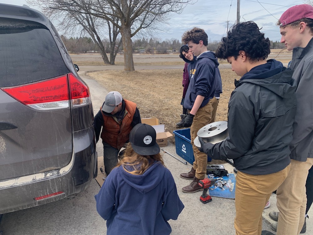 High schoolers get hands-on intro to auto mechanics